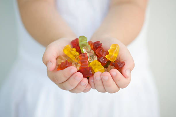 Beautiful gummy bears in palms.